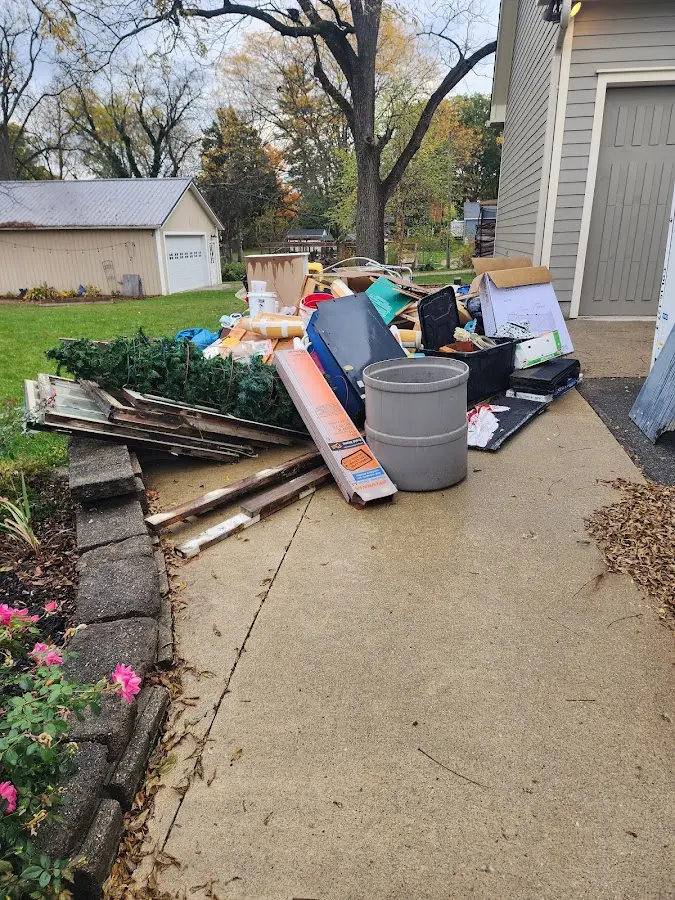 Dumpster being loaded with debris for 10 Yard Dumpster Rental in North Whitehall